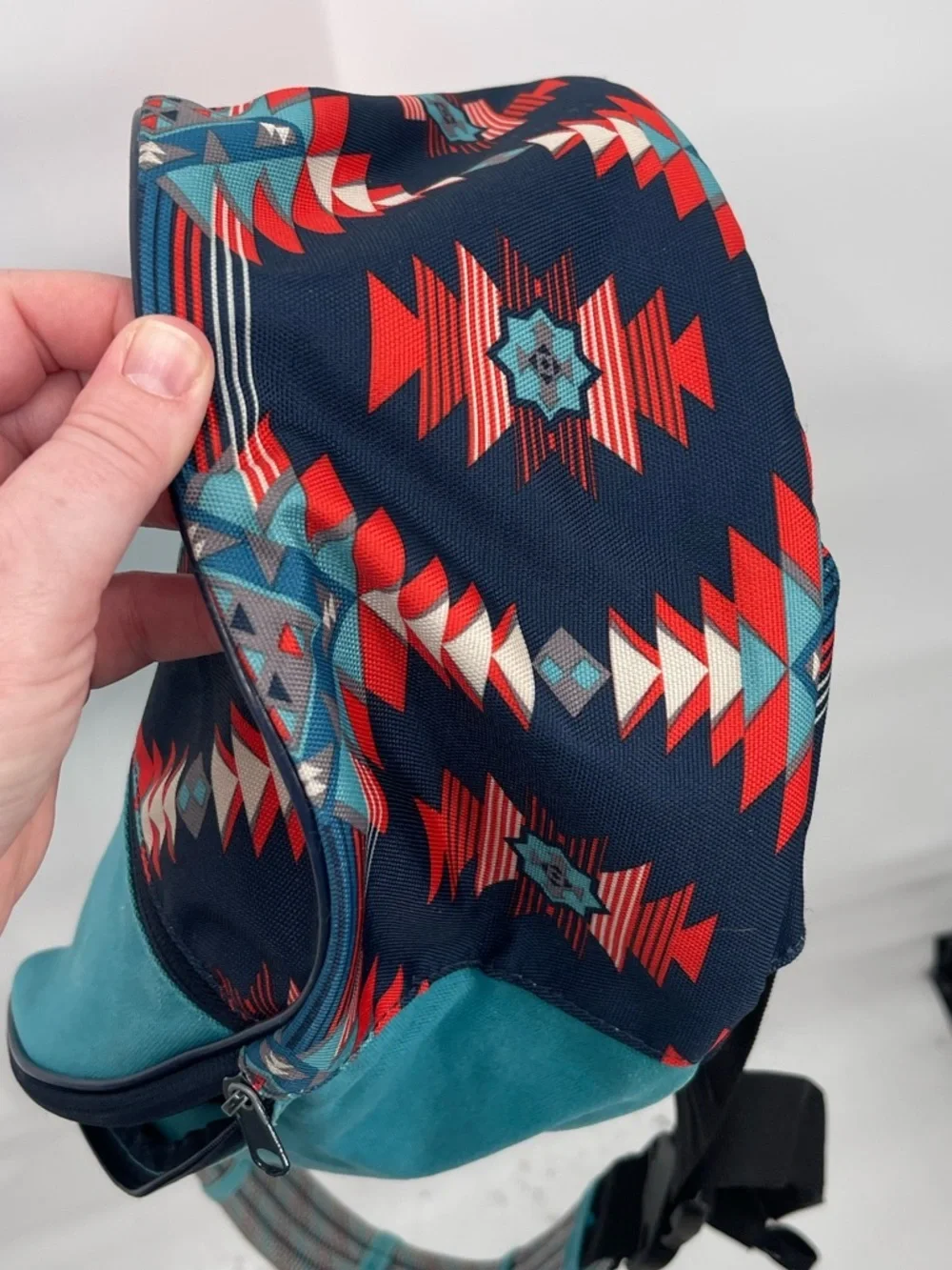 Kavu blue red aztec print sling back bag